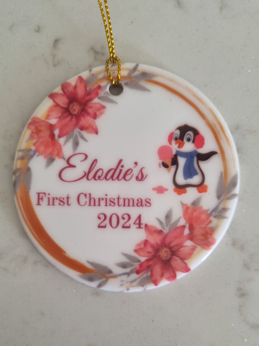 Beautiful ceramic ornament with gold circle and pretty pink flowers and a fun penguin eating an ice cream 